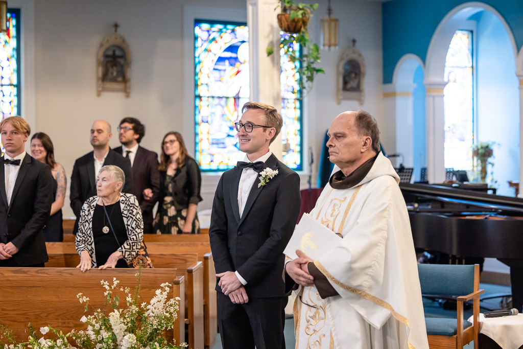 groom and pastor at church ceremony