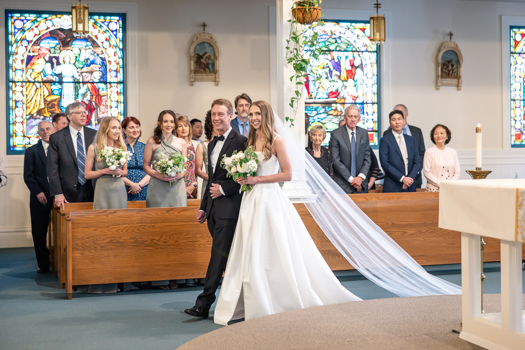 bride and dad entering church ceremony