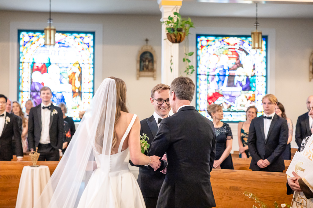 groom receiving bride at beginning of ceremony