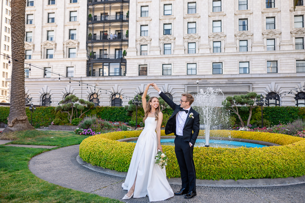 bride and groom dancing near the Fairmont roof garden fountain