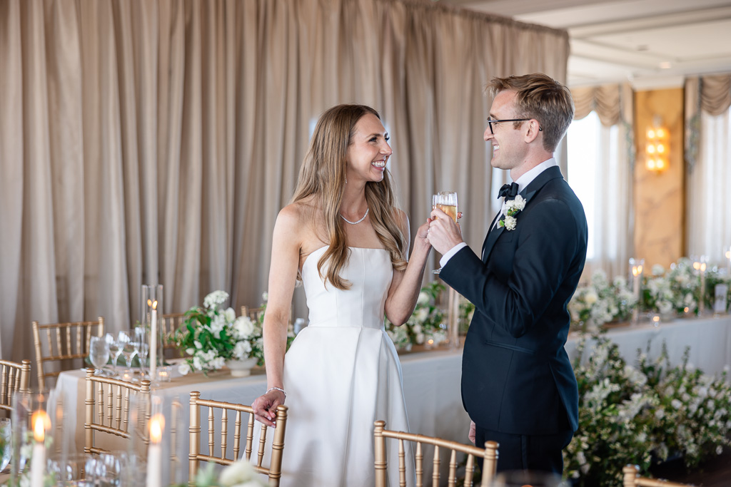 bride and groom sharing a moment before the reception begins