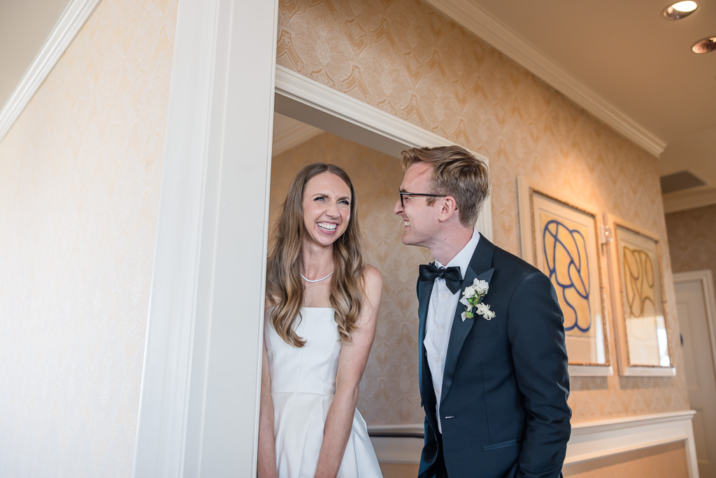 a cute candid moment between bride and groom