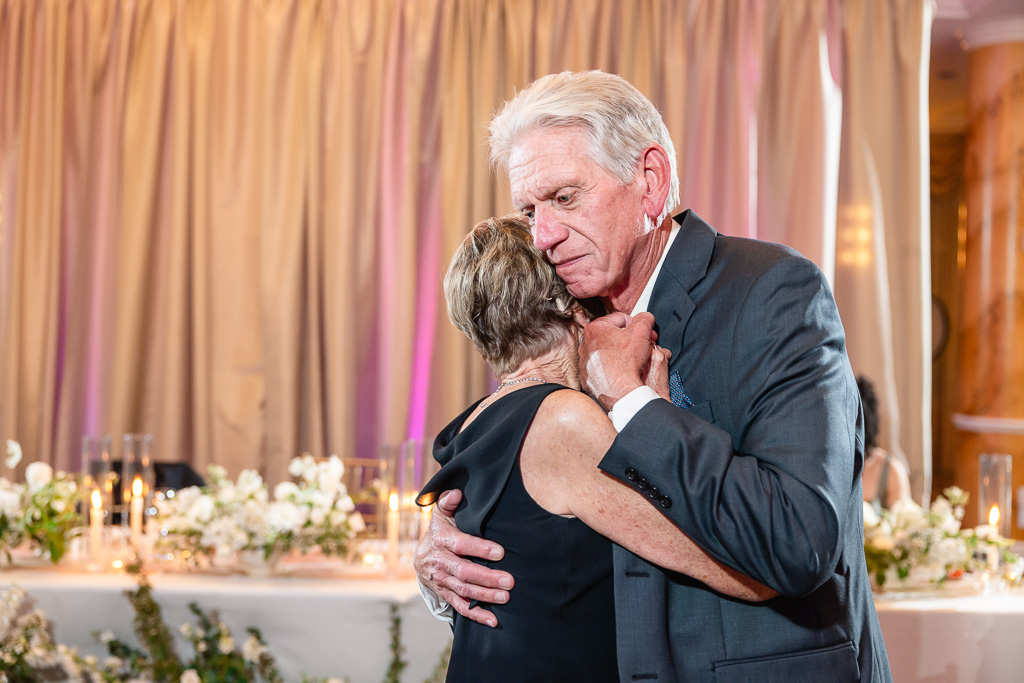 an older couple slow dancing together