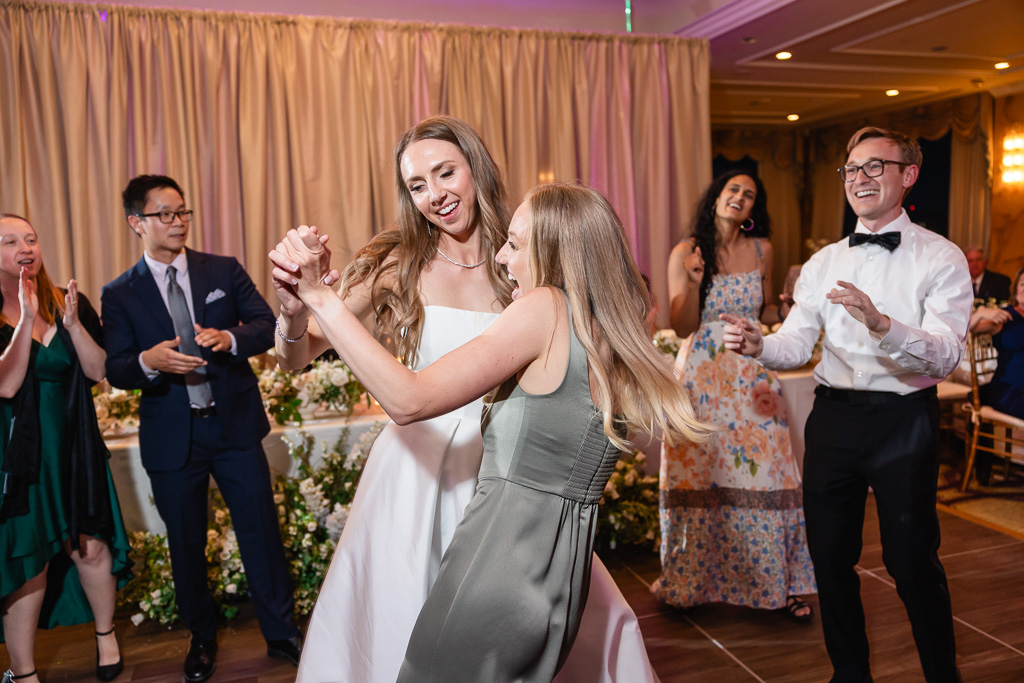 bride and sister on the dance floor