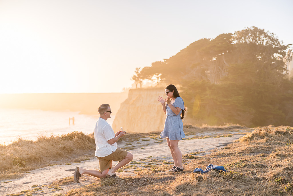 cliffside golden sunset surprise proposal at Davenport Beach