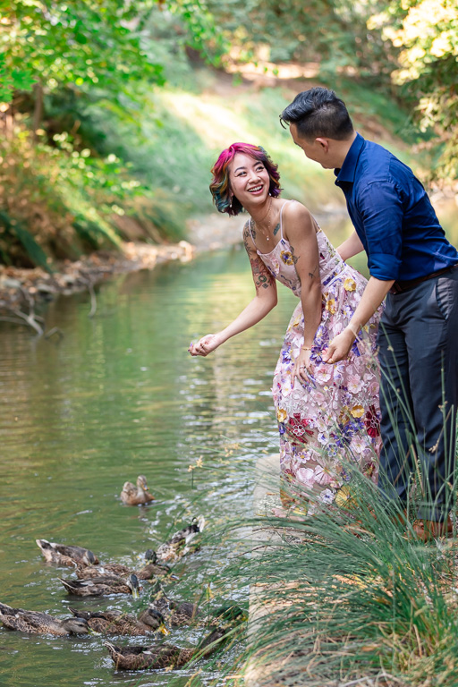 cute photo of couple feeding ducks together