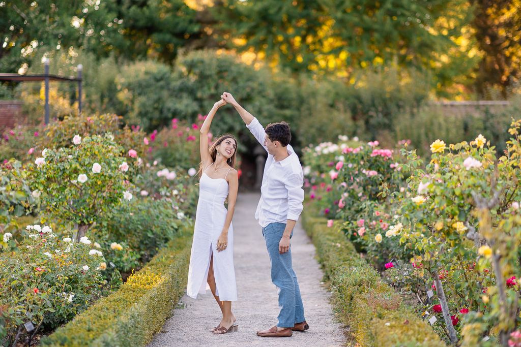 soft romantic rose garden engagement photo shoot