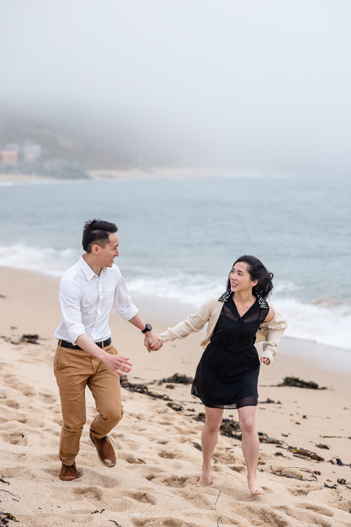 casual engagement photos on the beach