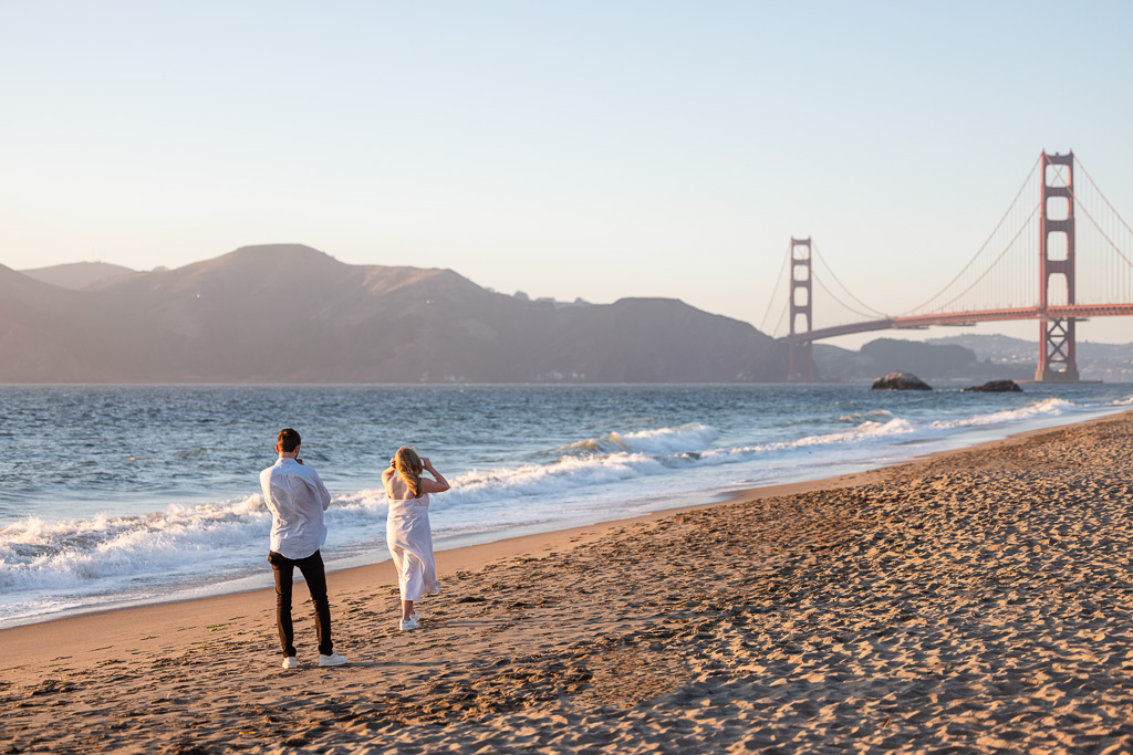 taking a photo from behind, looking at the Golden Gate Bridge