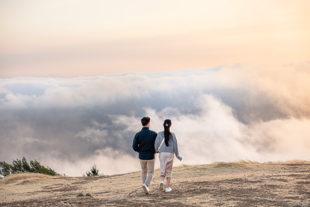 couple walking into a wall of fog