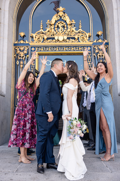 couple kissing outside the SF City Hall front door