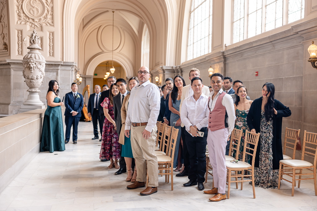 guests standing for the bride at City Hall