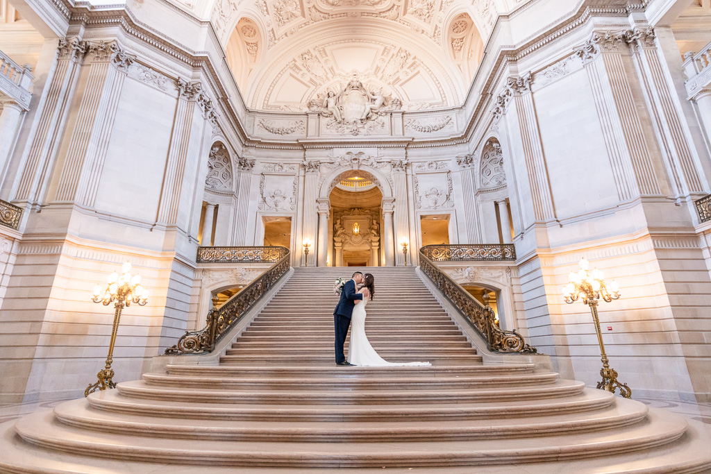 wedding photo on the iconic grand staircase at City Hall