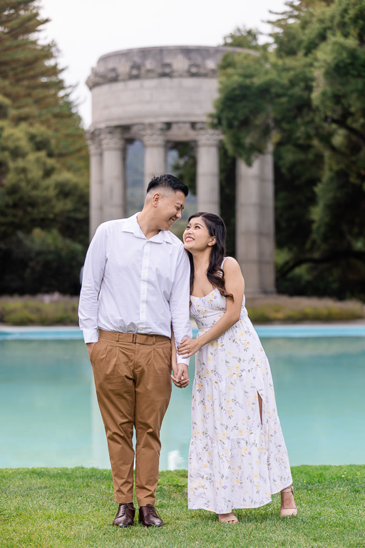 a cute standing engagement photo pose