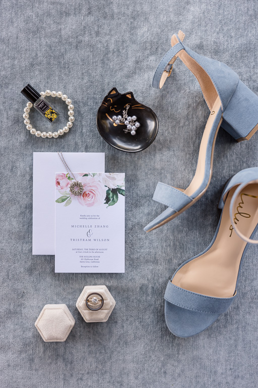 gray color theme wedding details flat lay