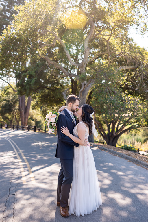 bride and groom walking on a road