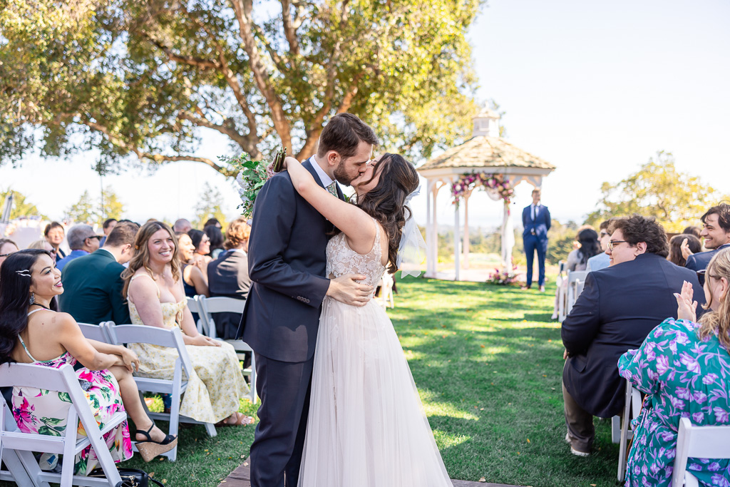 a second kiss at the end of the aisle after recessional