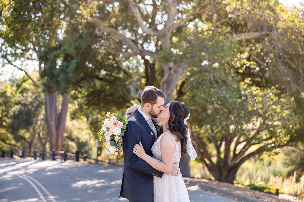 photo of bride and groom kissing