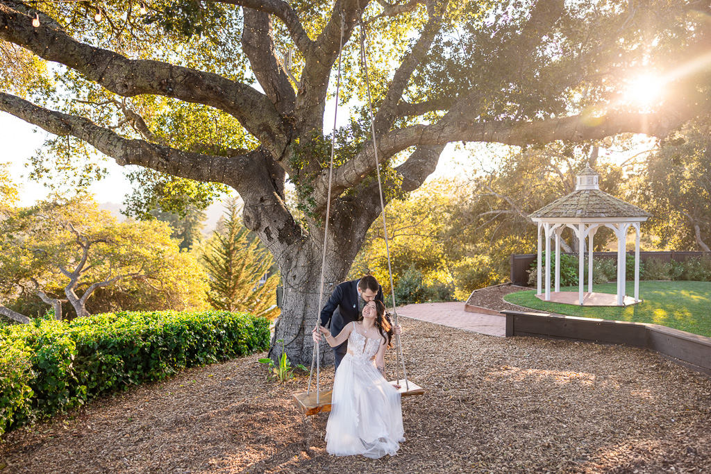 wedding photo on Hollins House swing at sunset with gazebo in the background