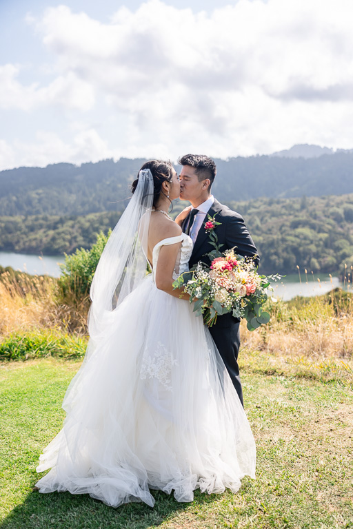 bride and groom kissing