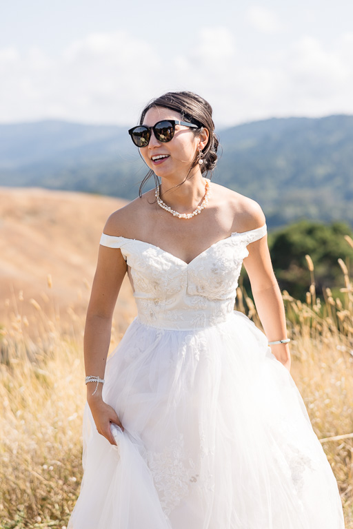 casual photo of bride wearing sunglasses