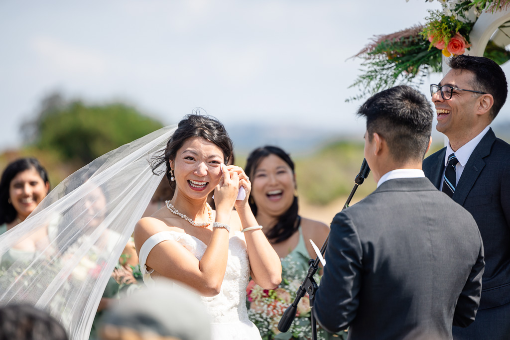 bride laughing during the ceremony