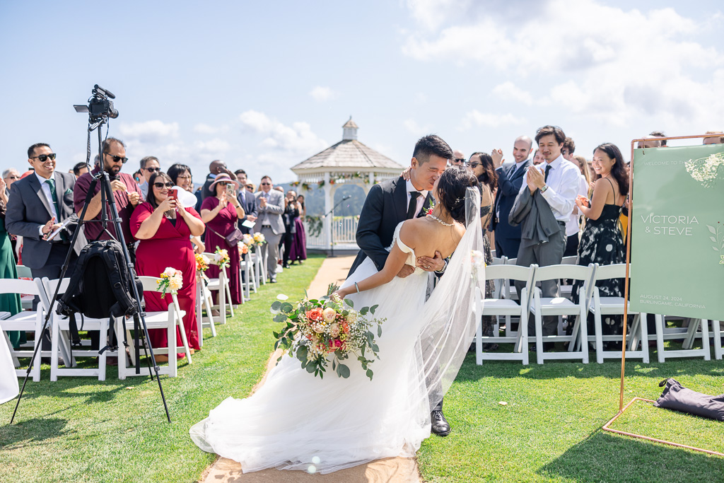 dip and kiss at the end of the aisle