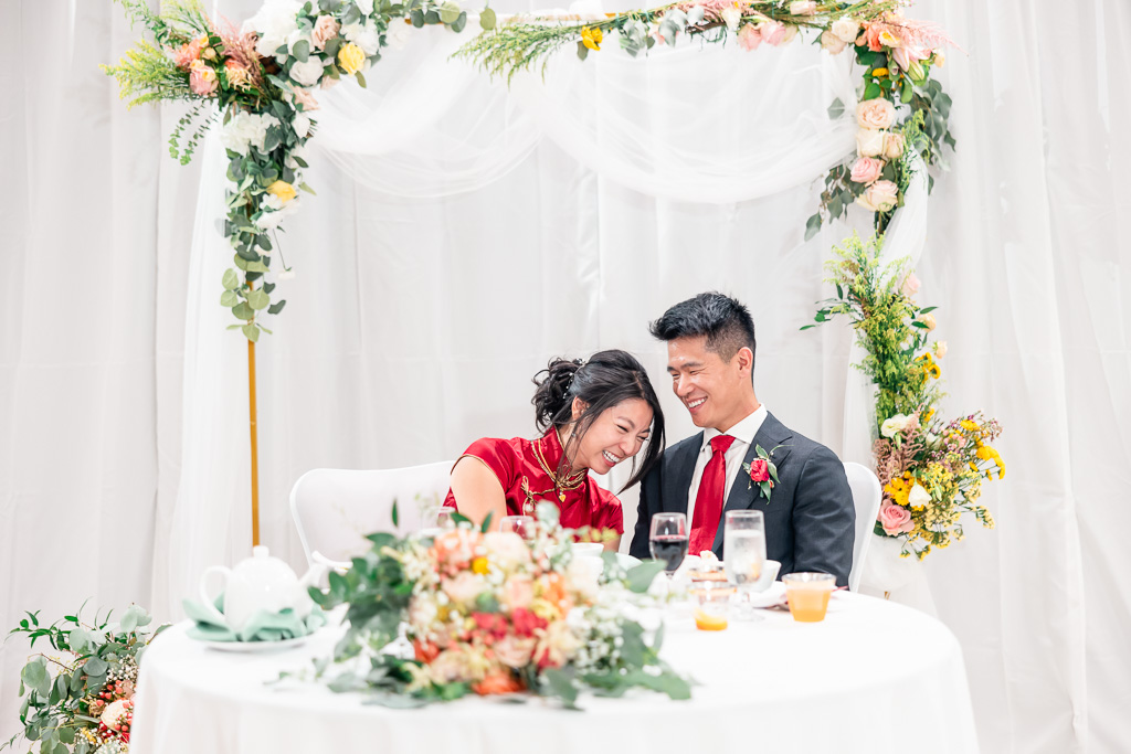 bride laughing at a funny dinner toast