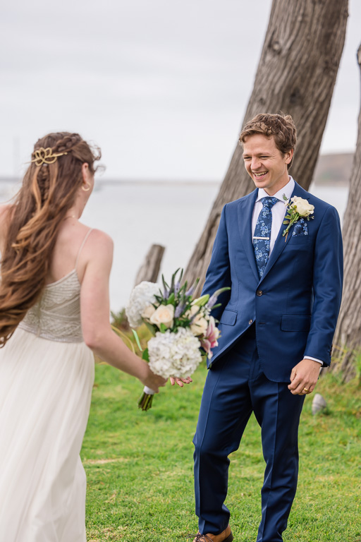 groom first look reaction