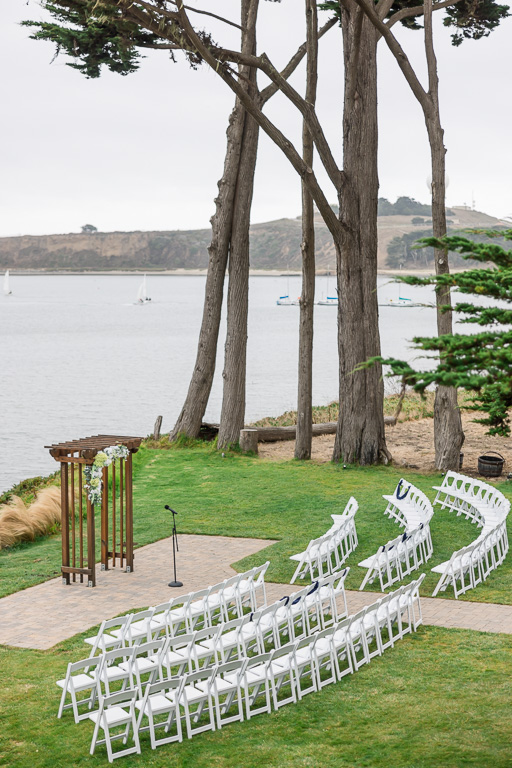 Mavericks House outdoor ceremony setup with curved chairs