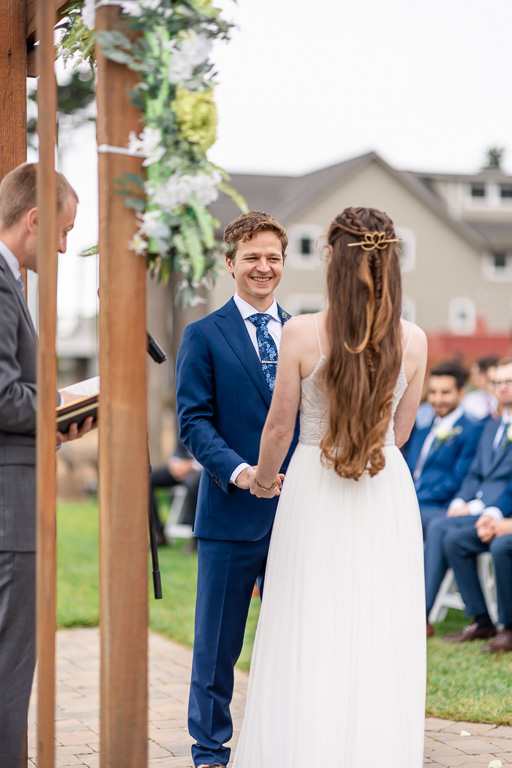 groom looking at the bride during ceremony