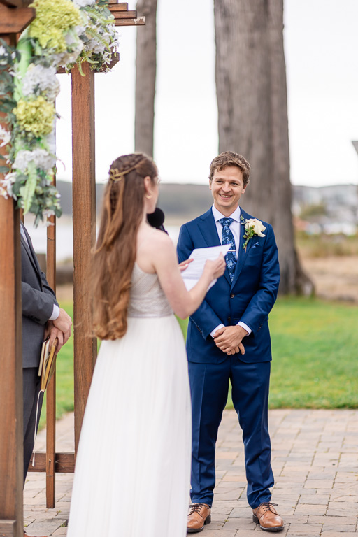 bride reading her personal vows off of a sheet of paper