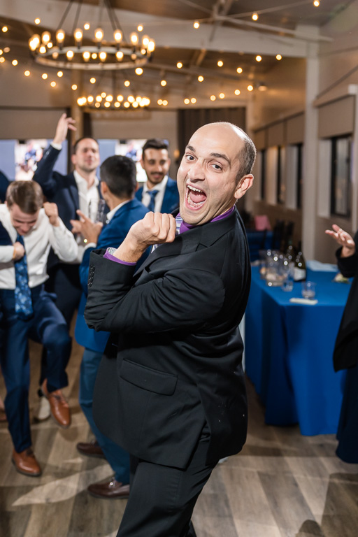 a guest at the wedding dancing