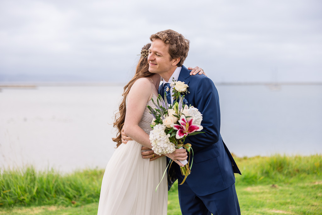 bride and groom hugging