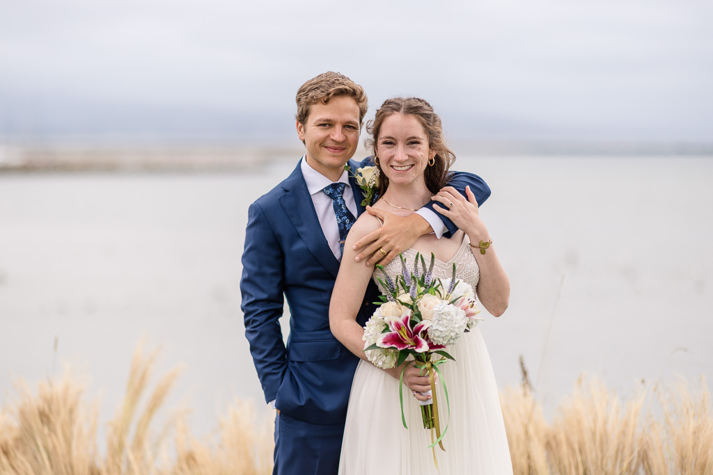 bride and groom with bouquet