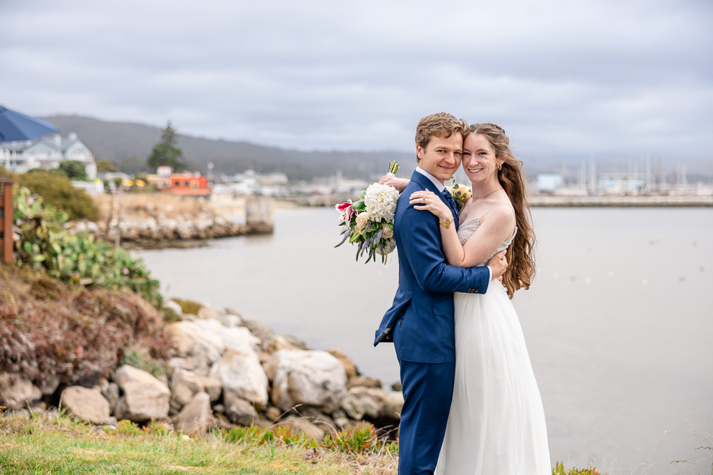 Half Moon Bay wedding photos by the shoreline with rocks