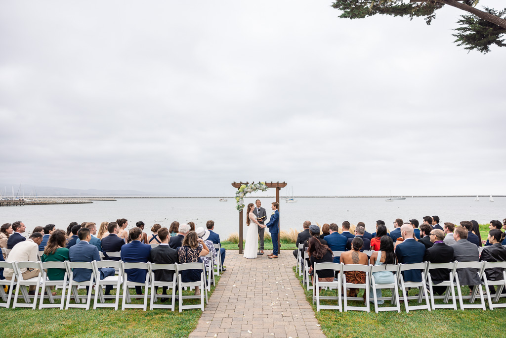 Mavericks House outdoor ceremony with guests seated