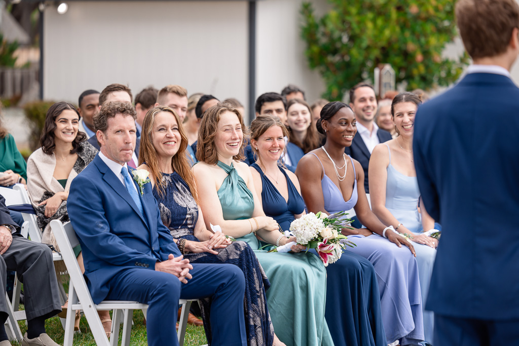 parents and bridesmaids in the audience during wedding ceremony