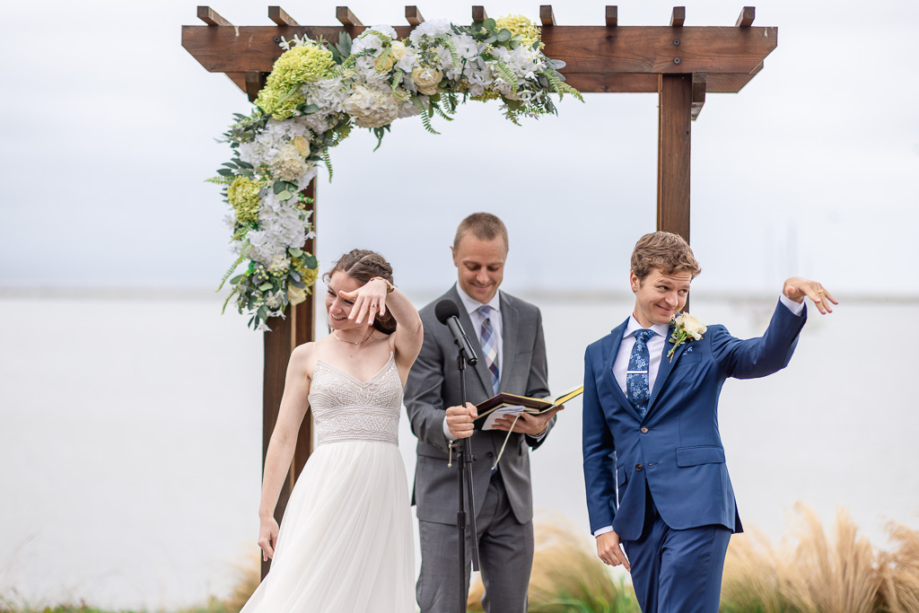 showing off wedding rings at the end of the ceremony