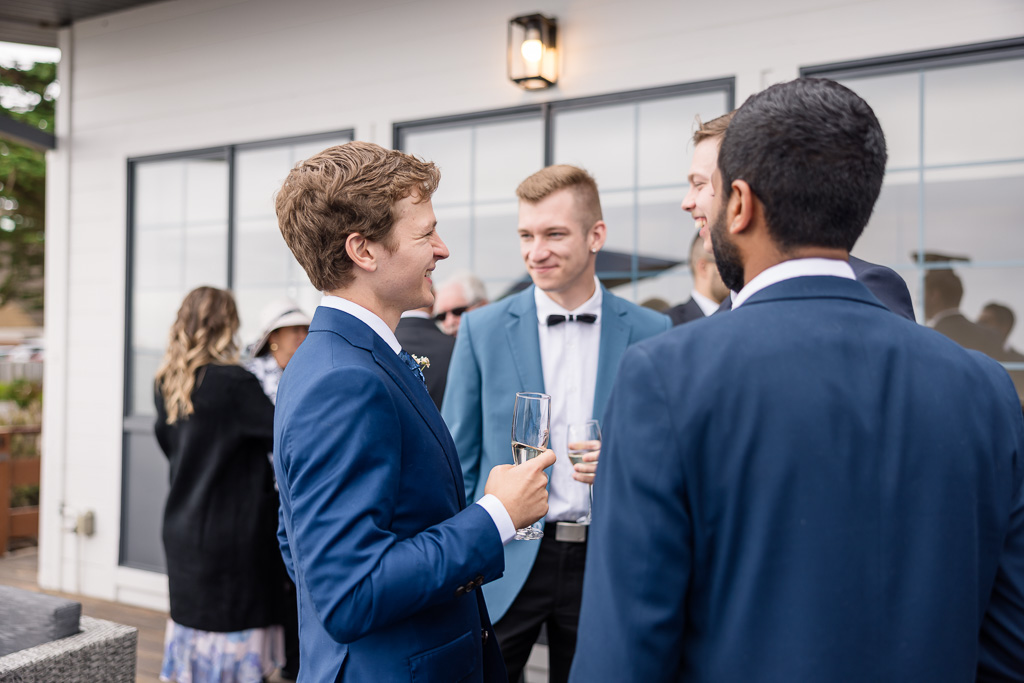 groom with his buddies at cocktail hour