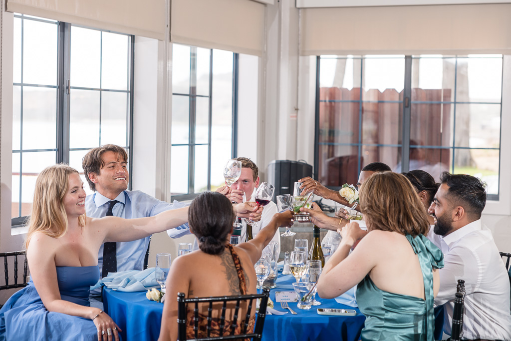 a table raising their glasses