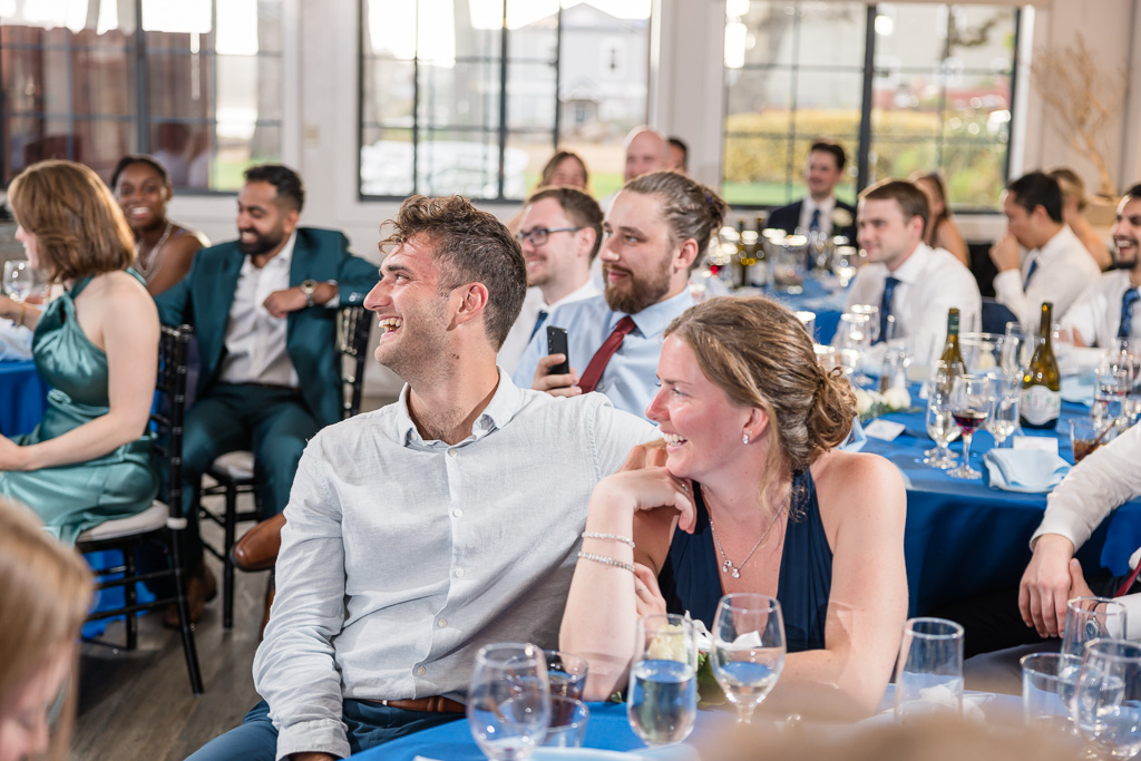 guests laughing at toasts