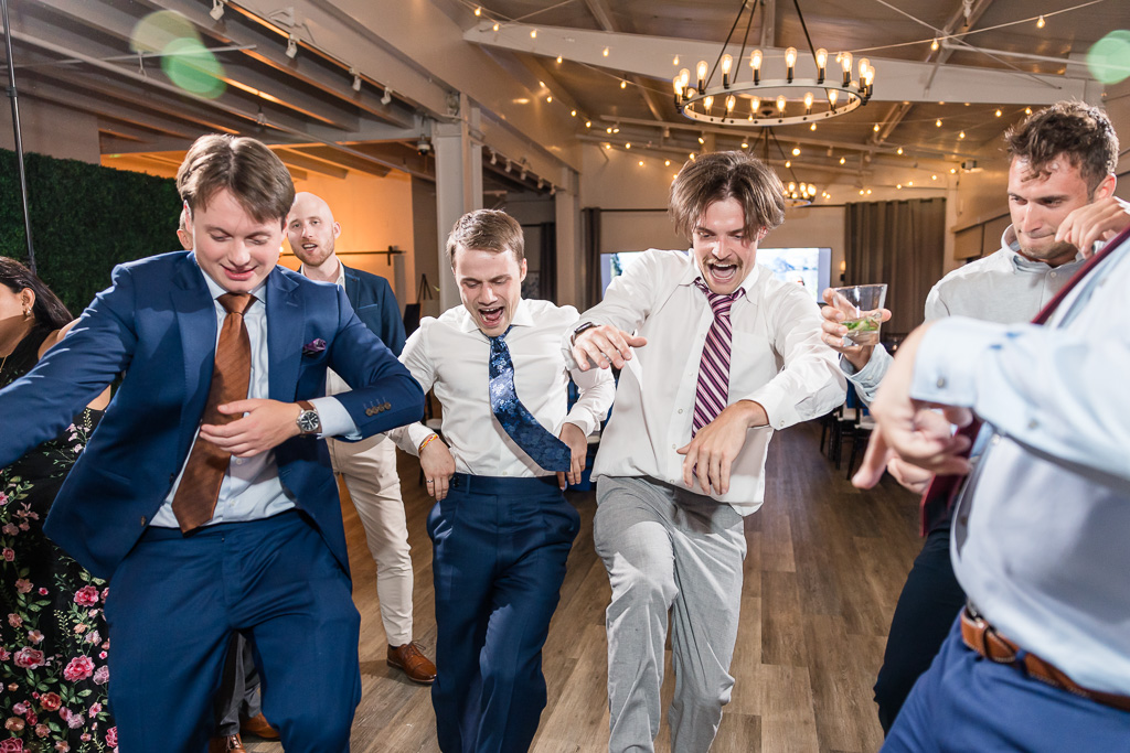 some dudes dancing on the dance floor at Mavericks House