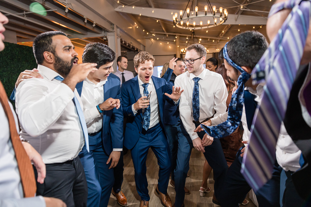 groom and his buddies dancing and singing