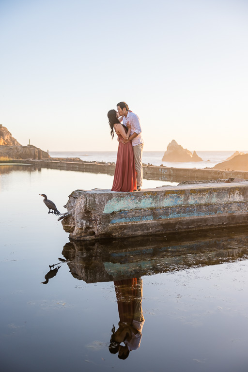 Sutro Baths engagement photo with a bird