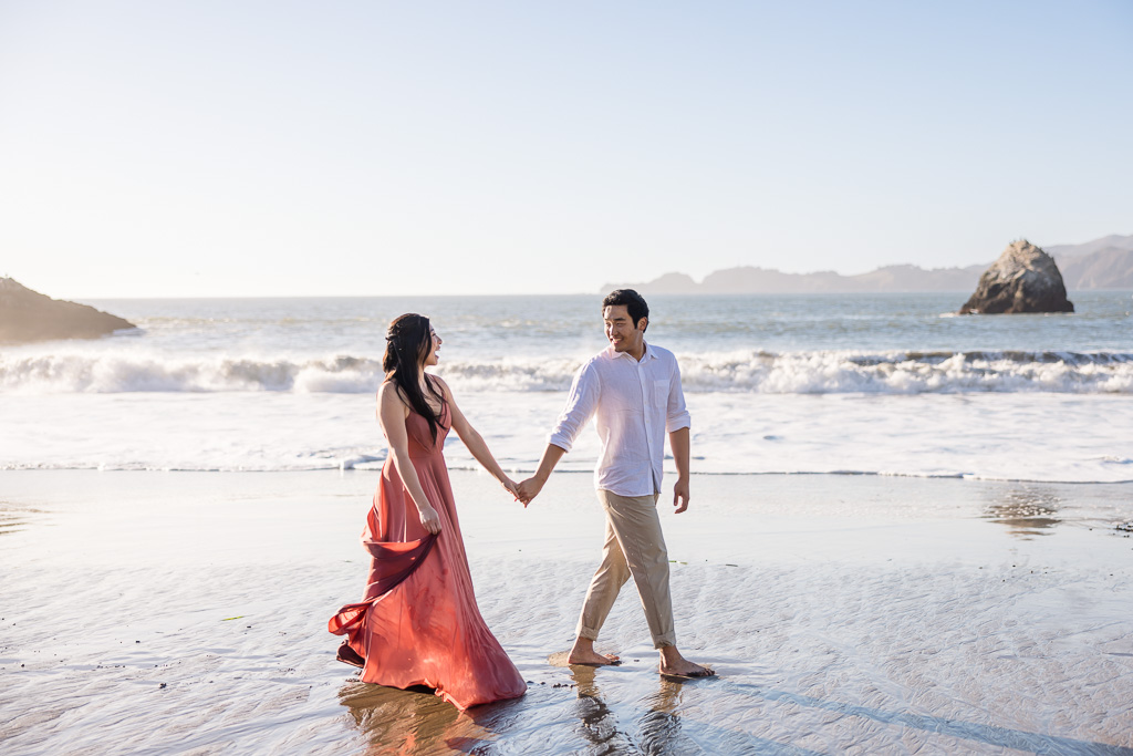 beach engagement photo on the water