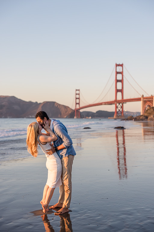 engagement photos on the reflective wet sand at Marshalls Beach