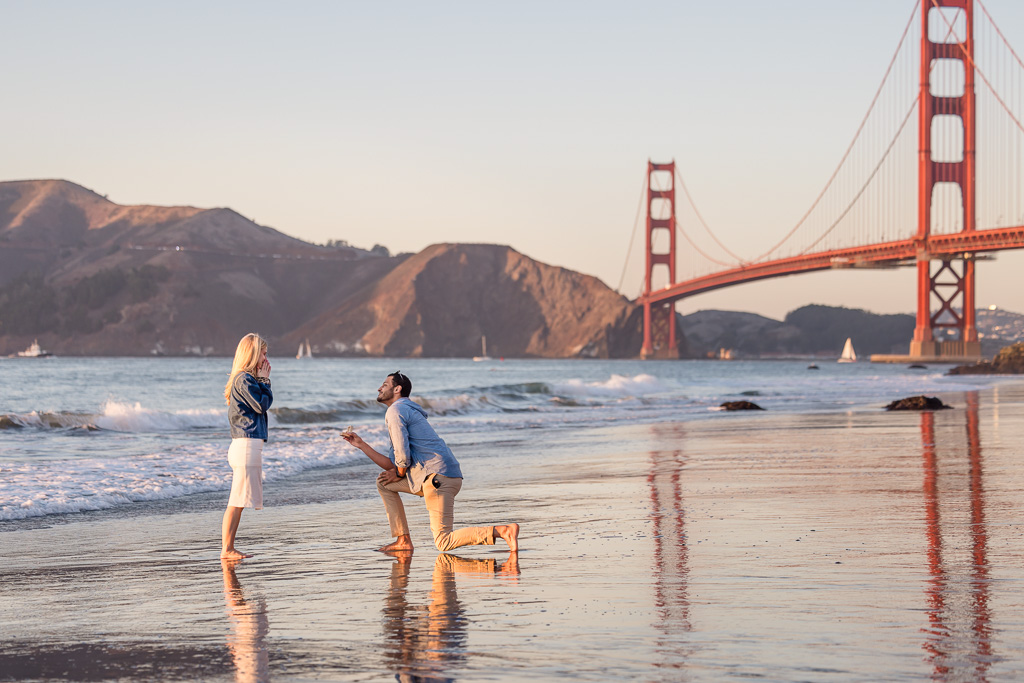 a colorful sunset surprise proposal at the Golden Gate Bridge