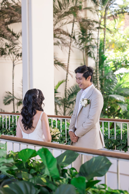 groom admiring his bride during the first look