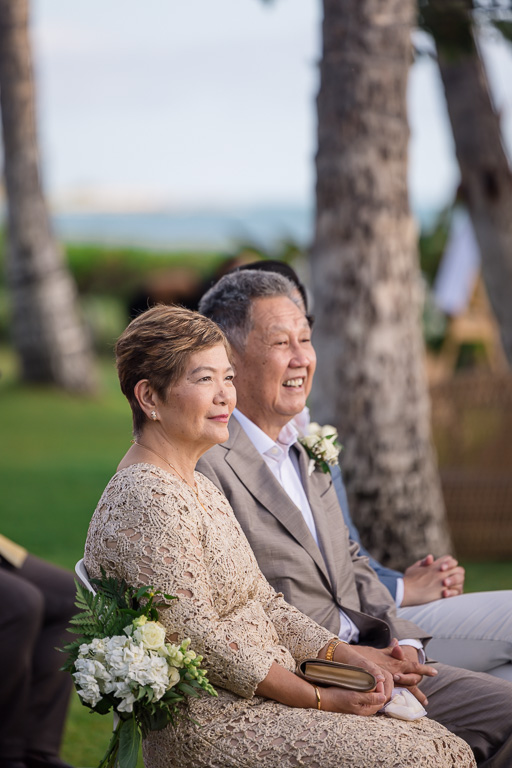 parents of the groom seated at wedding ceremony